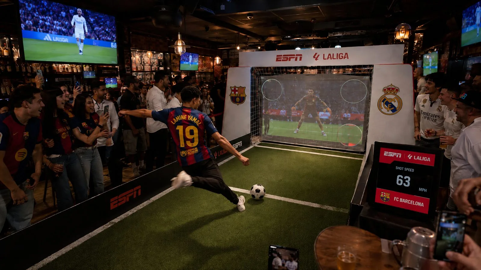 Virtual Kick activation in a sports bar: a fan takes a penalty against a virtual goalkeeper with shot speed scored for FC Barcelona