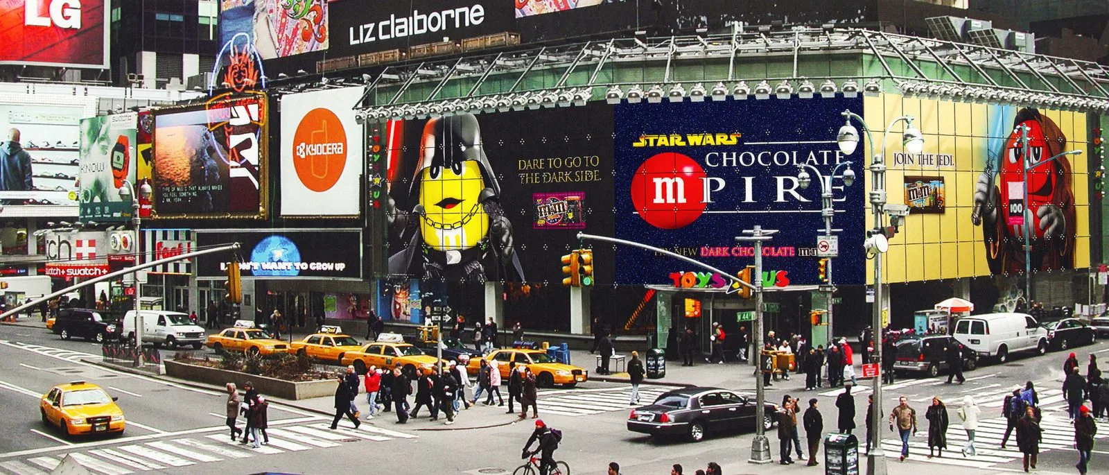 Times Square billboard by day: a yellow M&M dressed as Darth Vader with the line Dare to go to the dark side, the Star Wars Chocolate mPire logo, and a red M&M in Chewbacca fur under Join the Jedi, wrapping the Toys R Us corner