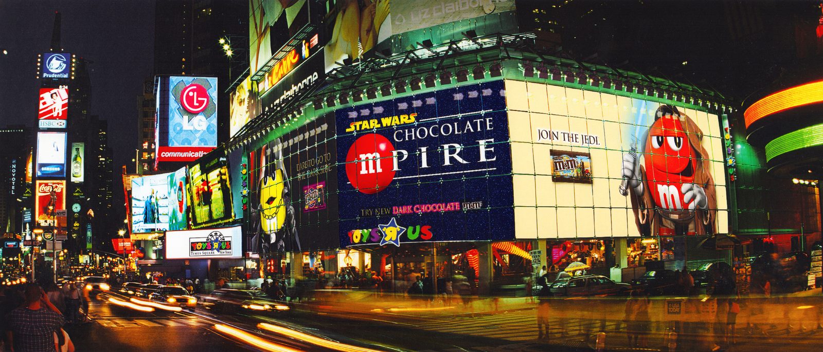 The same Star Wars Chocolate mPire billboard at night, fully lit over Times Square traffic, with Join the Jedi and Try New Dark Chocolate M&M's glowing