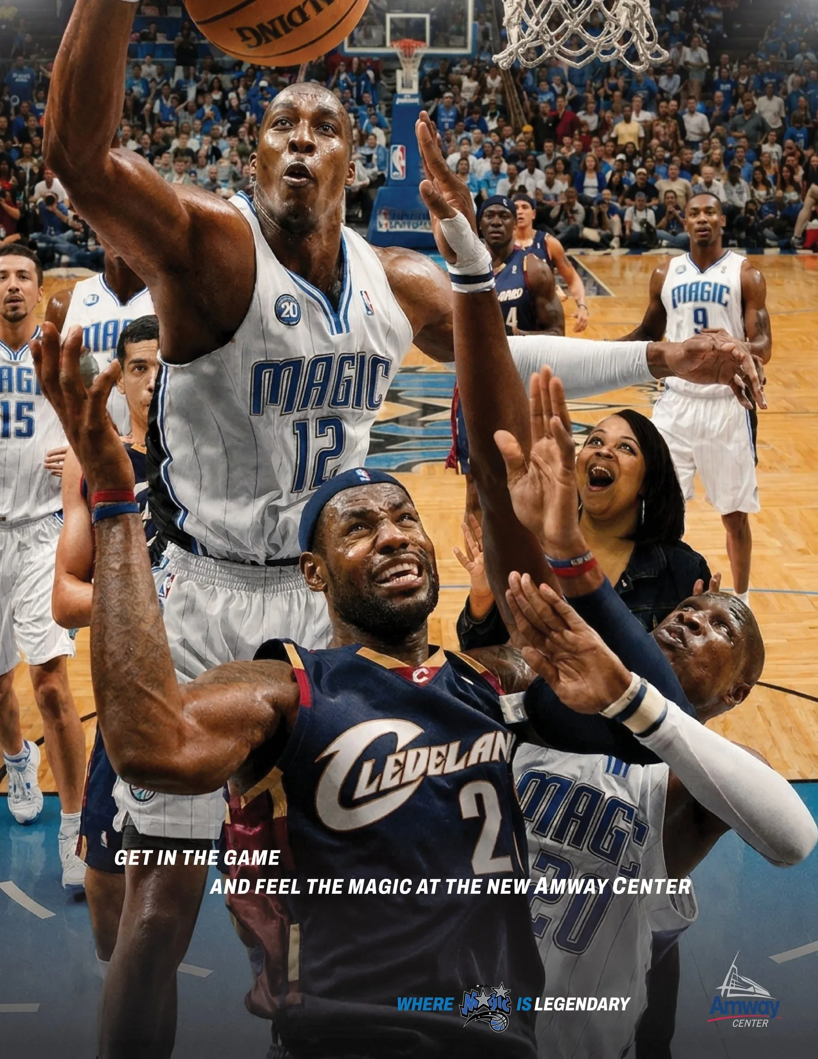Orlando Magic print ad: a Magic center blocks a Cleveland shot at the rim as a fan roars courtside, under the headline Get in the game and feel the Magic at the new Amway Center