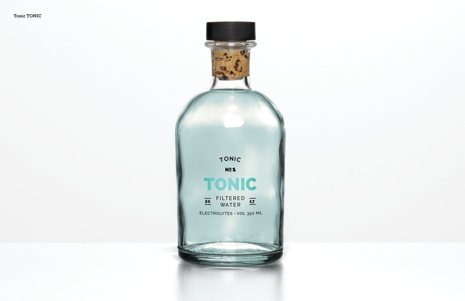 Corked apothecary-style glass bottle labeled TONIC No. 1 filtered water with electrolytes, 350 ml