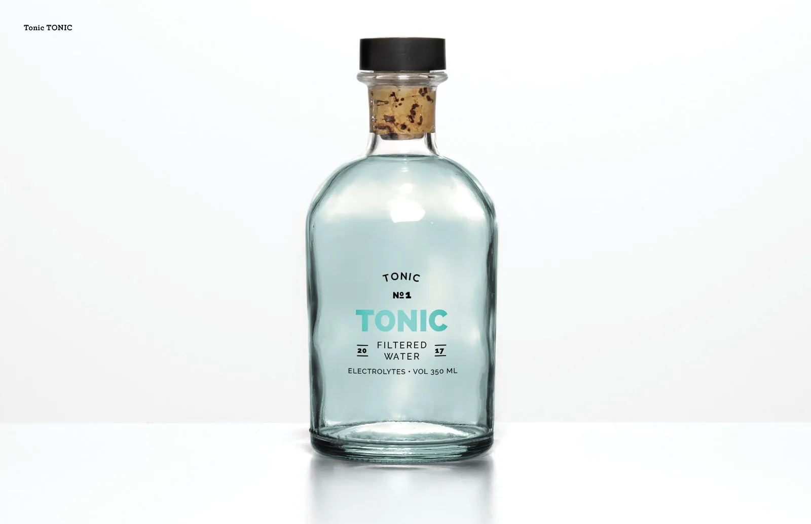 Corked apothecary-style glass bottle labeled TONIC No. 1 filtered water with electrolytes, 350 ml