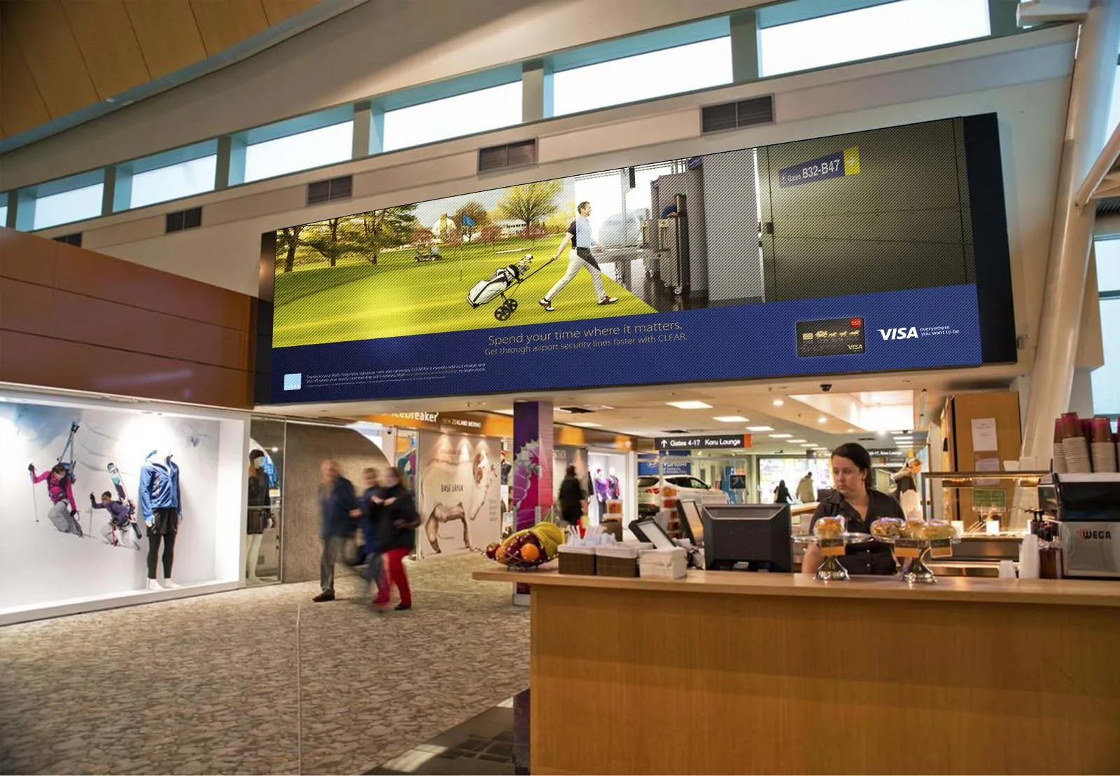Visa CLEAR terminal billboard: the golfer scene wiping from golf course into security checkpoint on a wide screen above an airport concourse